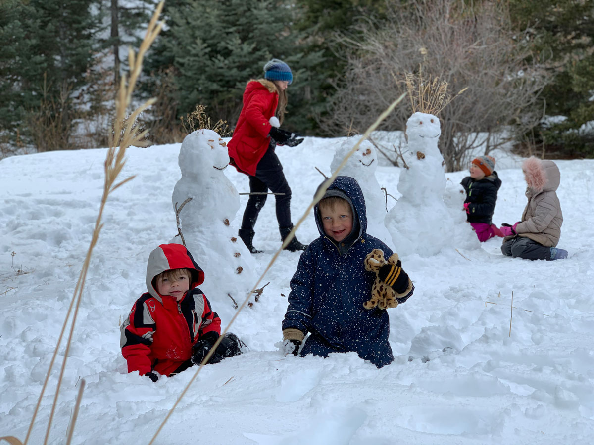 kids playing in the forest at Colorado Springs forest school nature kindergarten